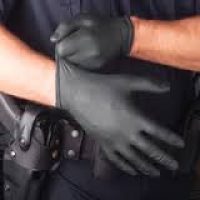 putting-on-black-nitrile-police-gloves